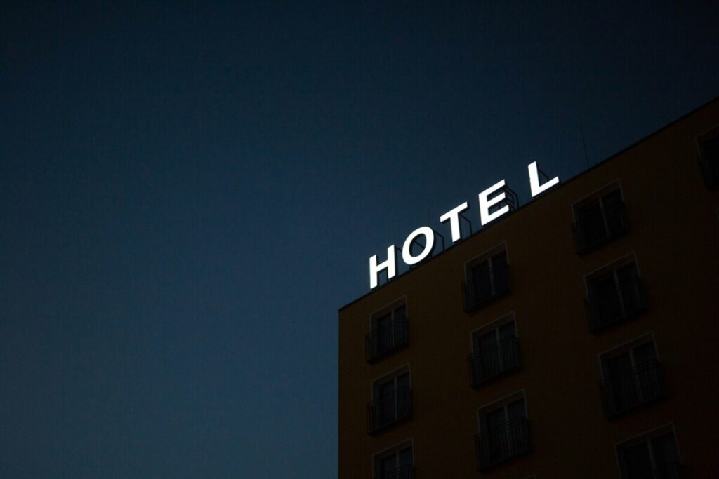 hotel sign at top of building